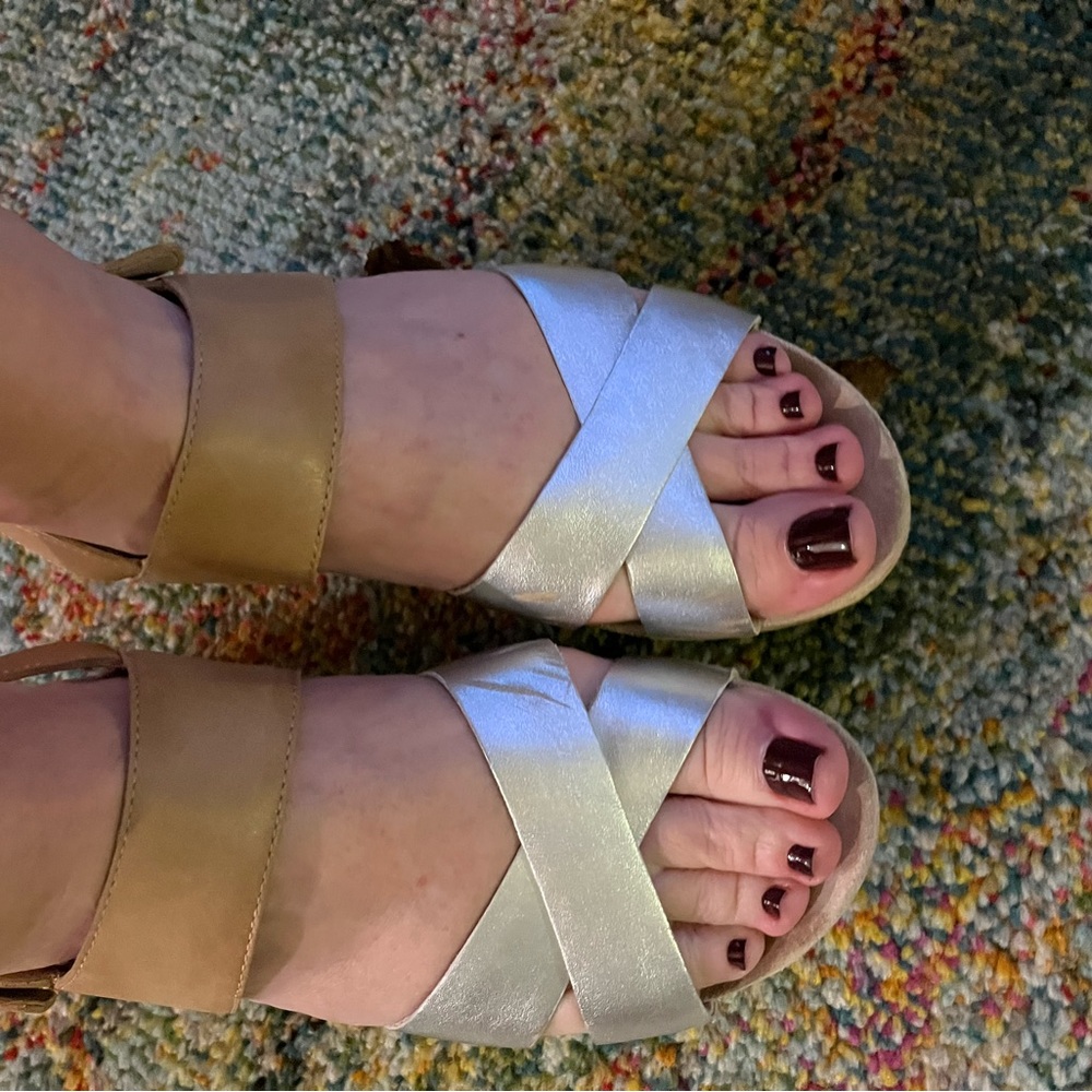 Silver and tan Dansko sandals. Light wear, but great condition!